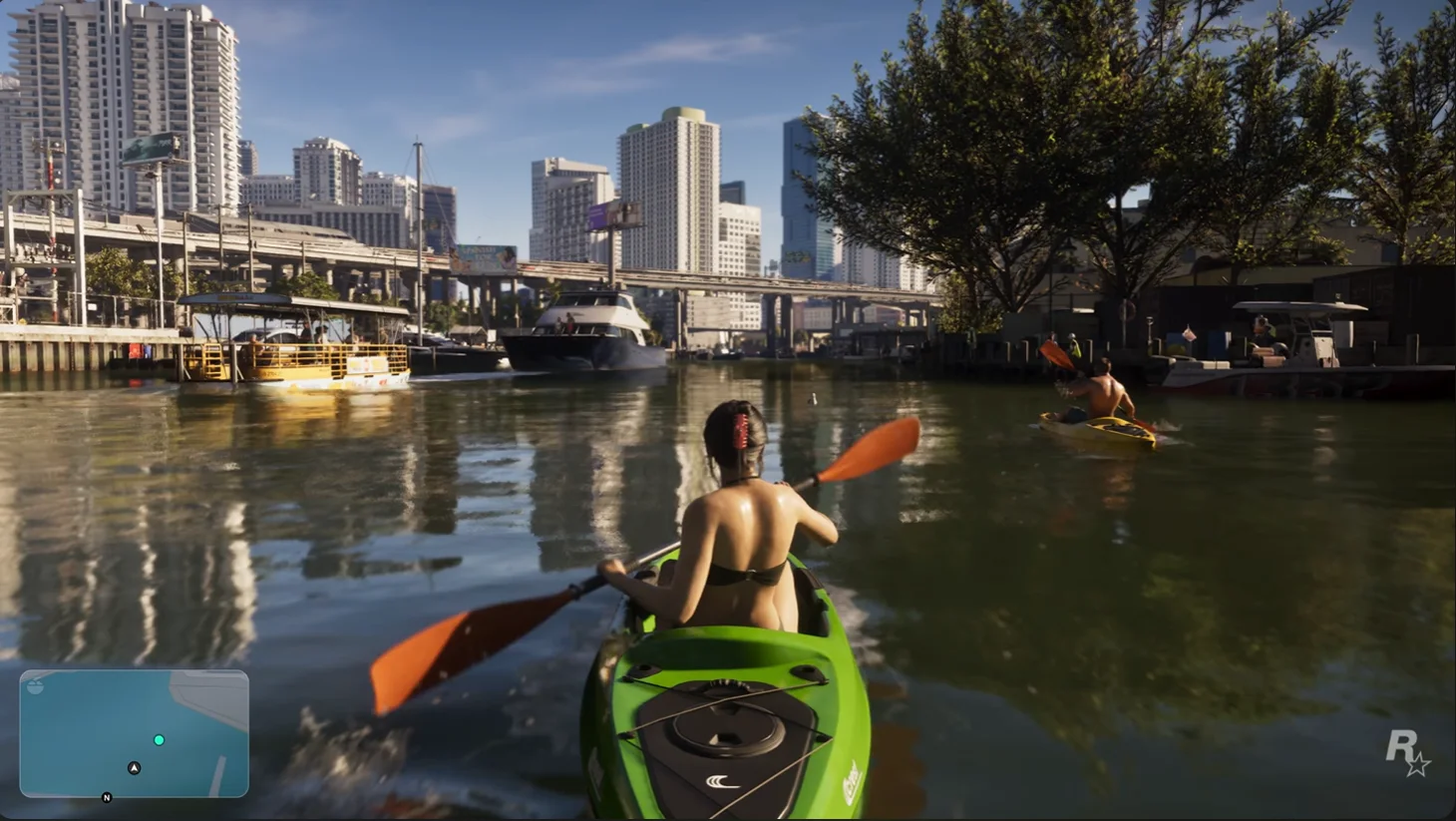 Two kayakers on a waterway beneath the buildings and bridges of Vice City.