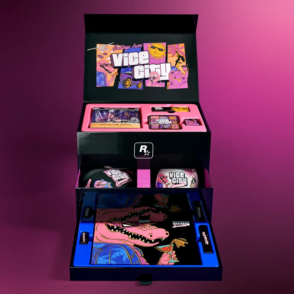 Vista oficial de la caja Vice City Collection abierta, con sus accesorios y objetos de colección.